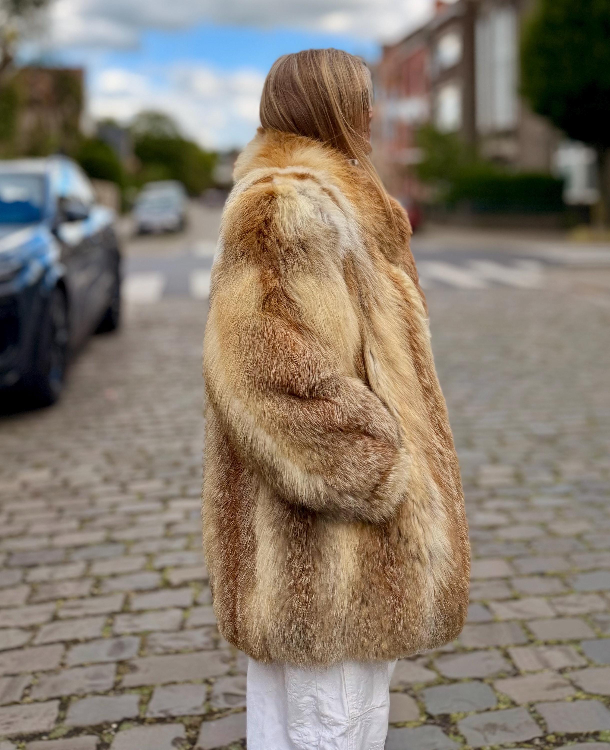 Bright red vintage fox fur coat with wide shoulders